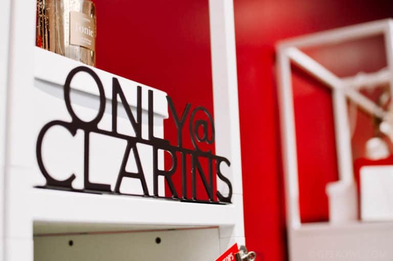 Only @ Clarins metal sign sitting on a shelf